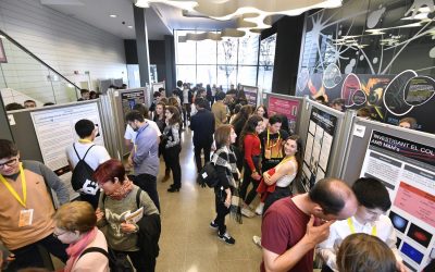 People looking at the posters of the Young Photonics Congress